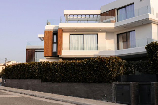 Modern glass railing systems installed on a contemporary building provide an unobstructed view.